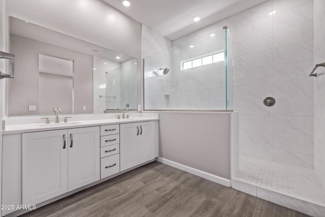 17118 N 50th Way, Scottsdale, AZ 85254 - full bathroom featuring double vanity, a walk in shower, wood finished floors, and recessed lighting