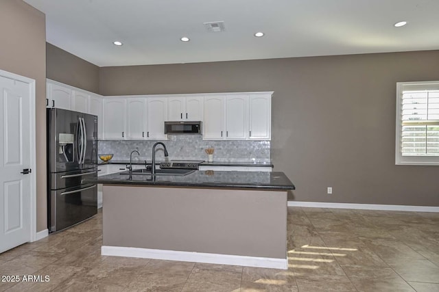 kitchen featuring a kitchen island with sink, white cabinets, and black appliances