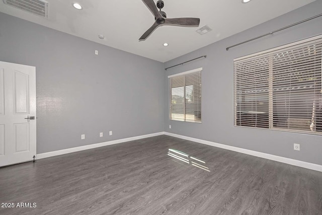 unfurnished room with dark wood-type flooring and ceiling fan