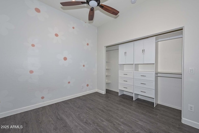 unfurnished bedroom with dark wood-type flooring, ceiling fan, and a closet