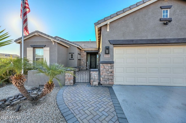 view of front of property with a garage