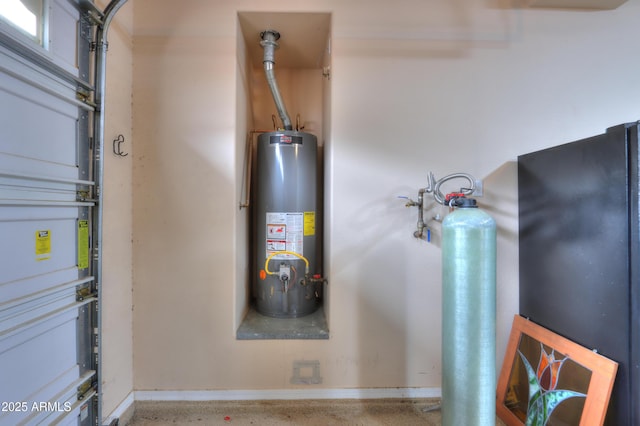 utility room with a garage and gas water heater