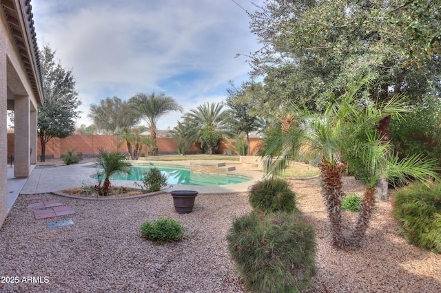 view of pool with a fenced in pool, a fenced backyard, and a patio