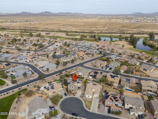 aerial view with a residential view and a water and mountain view