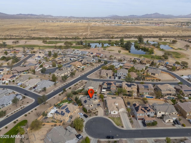 aerial view with a residential view and a water and mountain view