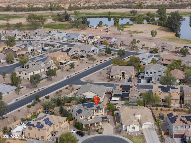 aerial view with a water view and a residential view