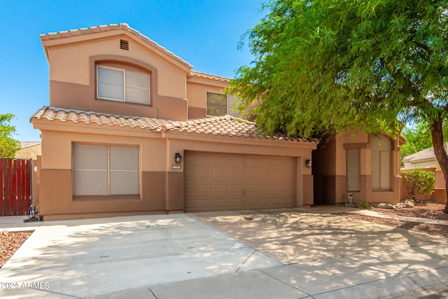 mediterranean / spanish-style home featuring a garage