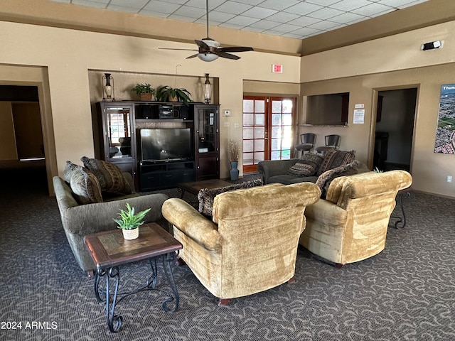 living room featuring a paneled ceiling, french doors, dark colored carpet, and ceiling fan