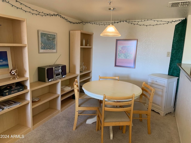 view of carpeted dining area