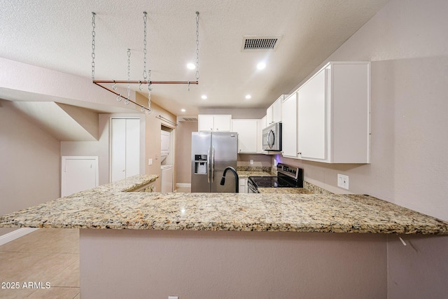 2301 E University Dr Unit 210, Mesa, AZ 85213 - kitchen with appliances with stainless steel finishes, recessed lighting, light stone counters, a peninsula, and white cabinets