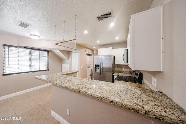 2301 E University Dr Unit 210, Mesa, AZ 85213 - kitchen featuring stainless steel appliances, washer / dryer, a peninsula, light stone counters, and white cabinetry