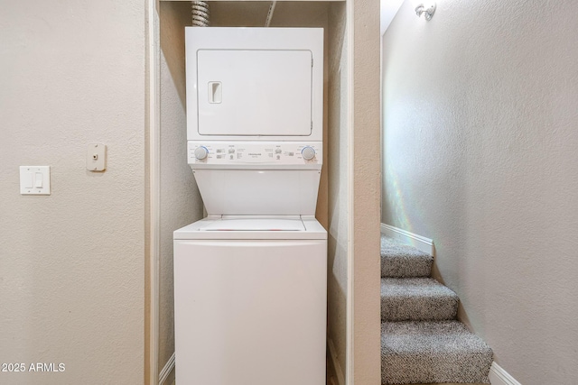 2301 E University Dr Unit 210, Mesa, AZ 85213 - laundry room with stacked washer and clothes dryer and a textured wall