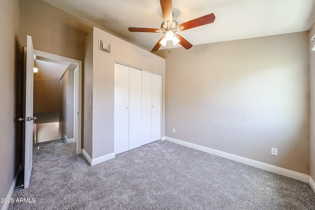 2301 E University Dr Unit 210, Mesa, AZ 85213 - unfurnished bedroom featuring carpet flooring, a closet, and a ceiling fan