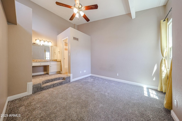 2301 E University Dr Unit 210, Mesa, AZ 85213 - unfurnished bedroom with carpet, built in study area, ensuite bath, beamed ceiling, and ceiling fan