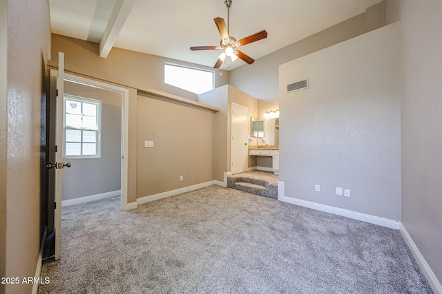 2301 E University Dr Unit 210, Mesa, AZ 85213 - empty room with ceiling fan, carpet flooring, and beam ceiling