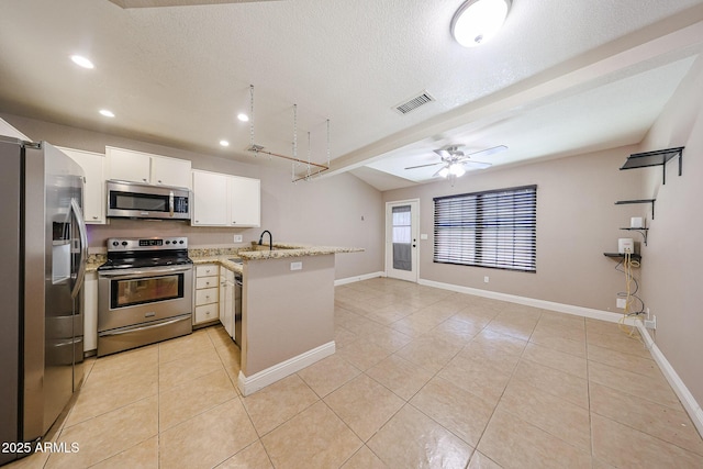 2301 E University Dr Unit 210, Mesa, AZ 85213 - kitchen with stainless steel appliances, a peninsula, light tile patterned floors, recessed lighting, and ceiling fan