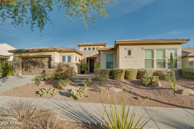 prairie-style home featuring a garage