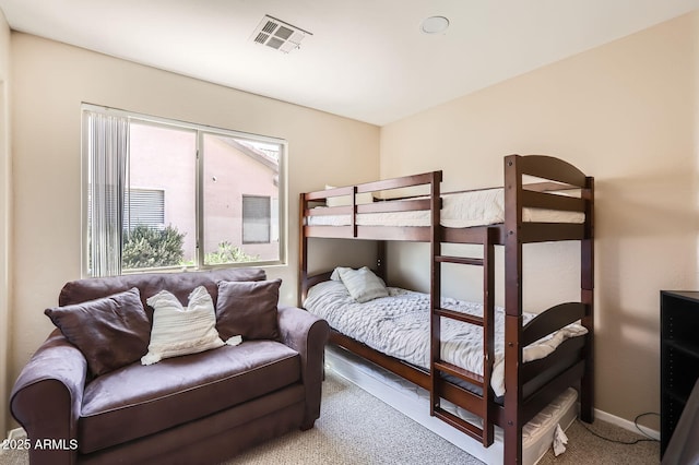 bedroom featuring carpet flooring, baseboards, and visible vents