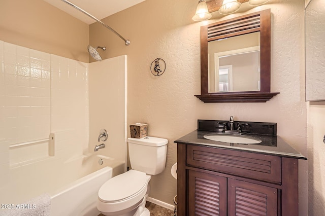 full bathroom featuring toilet, shower / washtub combination, vanity, and a textured wall