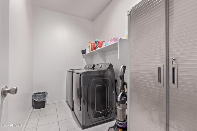2347 W Sunland Ave, Phoenix, AZ 85041 - laundry room with washing machine and dryer and light tile patterned floors