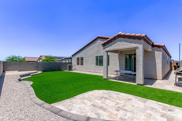 2347 W Sunland Ave, Phoenix, AZ 85041 - back of house featuring a patio area, a fenced backyard, stucco siding, and a tile roof
