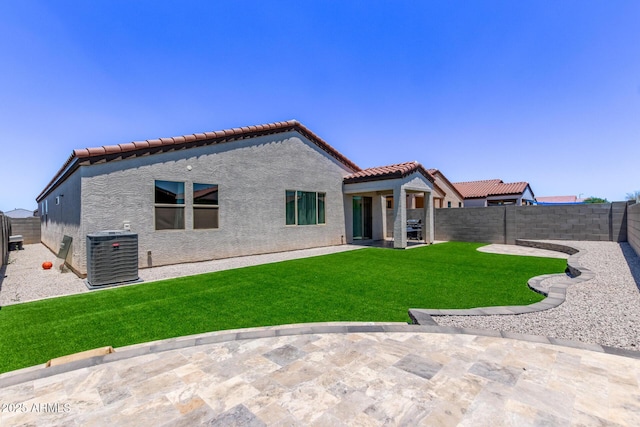 2347 W Sunland Ave, Phoenix, AZ 85041 - back of house featuring a tile roof, stucco siding, a fenced backyard, and a patio