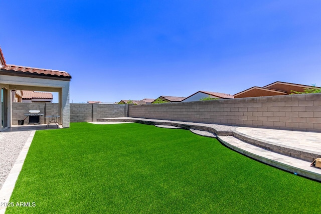 2347 W Sunland Ave, Phoenix, AZ 85041 - fenced backyard with a patio