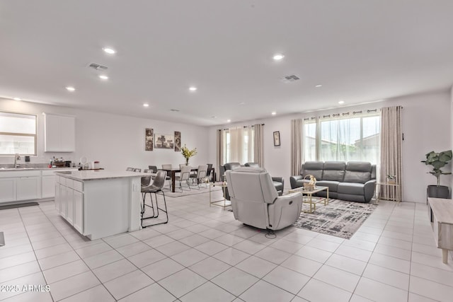 2347 W Sunland Ave, Phoenix, AZ 85041 - living area featuring recessed lighting and light tile patterned floors