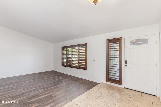 entrance foyer with light hardwood / wood-style floors and plenty of natural light