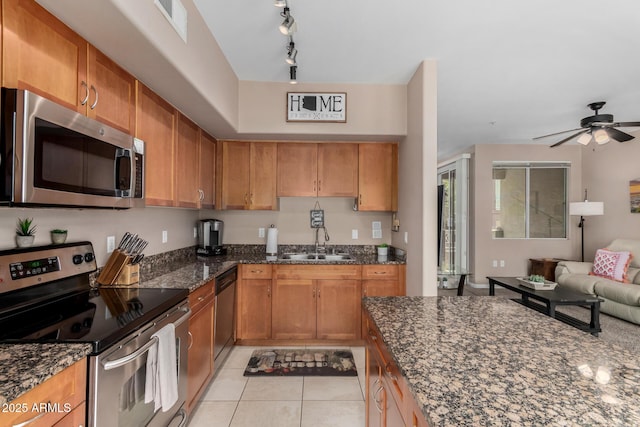 1920 E Bell Rd Unit 1189, Phoenix, AZ 85022 - kitchen featuring appliances with stainless steel finishes, a sink, dark stone counters, and open floor plan
