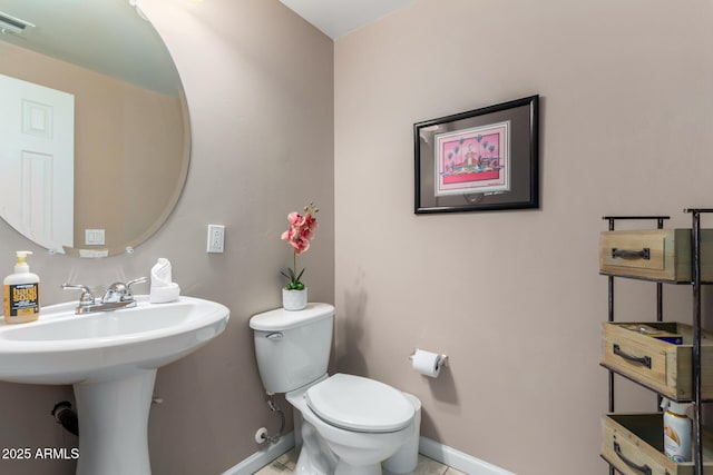 1920 E Bell Rd Unit 1189, Phoenix, AZ 85022 - half bath featuring baseboards, toilet, and a sink
