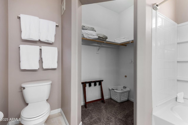 1920 E Bell Rd Unit 1189, Phoenix, AZ 85022 - bathroom featuring toilet, a spacious closet,  shower combination, and baseboards
