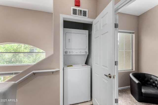 1920 E Bell Rd Unit 1189, Phoenix, AZ 85022 - laundry room with stacked washer / dryer and baseboards