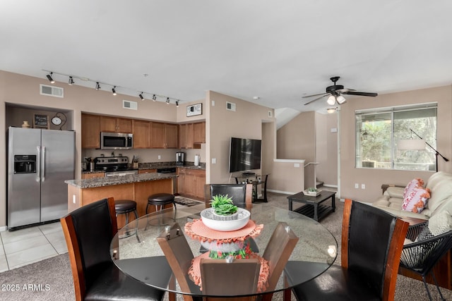1920 E Bell Rd Unit 1189, Phoenix, AZ 85022 - dining area featuring a ceiling fan and light colored carpet