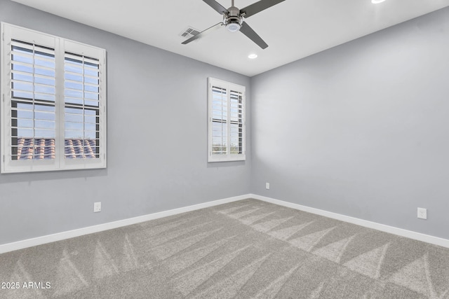 carpeted spare room featuring visible vents, baseboards, a ceiling fan, and recessed lighting