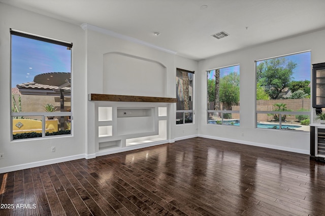 10310 N 135th Way, Scottsdale, AZ 85259 - unfurnished living room featuring wood finished floors and built in shelves