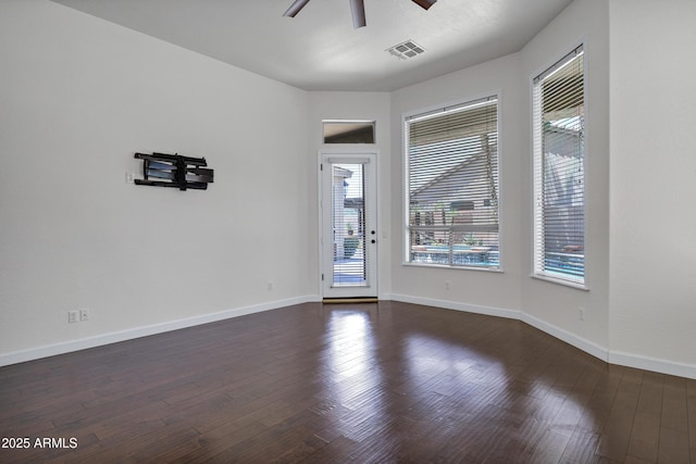 10310 N 135th Way, Scottsdale, AZ 85259 - spare room featuring a ceiling fan, plenty of natural light, and dark wood-style flooring