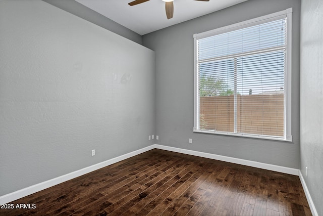 10310 N 135th Way, Scottsdale, AZ 85259 - unfurnished room featuring a ceiling fan and dark wood-style flooring