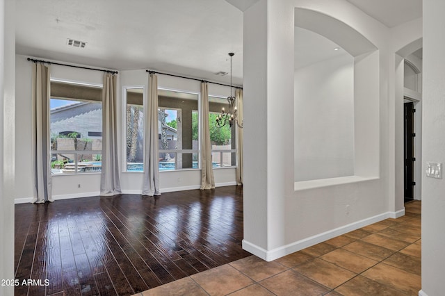 10310 N 135th Way, Scottsdale, AZ 85259 - spare room with arched walkways and wood-type flooring