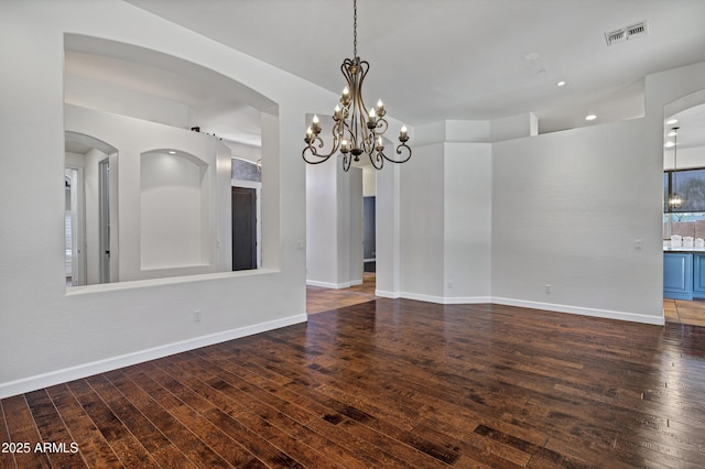 10310 N 135th Way, Scottsdale, AZ 85259 - empty room with hardwood / wood-style flooring, a chandelier, and arched walkways
