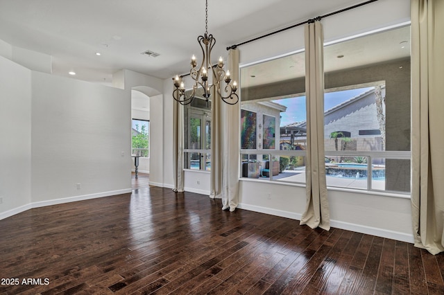 10310 N 135th Way, Scottsdale, AZ 85259 - unfurnished dining area featuring a chandelier, hardwood / wood-style flooring, arched walkways, and recessed lighting