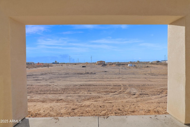 view of yard with a rural view