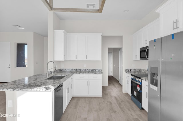 kitchen featuring white cabinets, sink, and stainless steel appliances