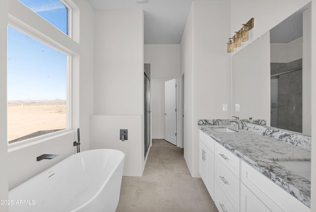 bathroom featuring concrete flooring, shower with separate bathtub, and vanity