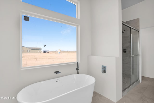 bathroom with plus walk in shower and tile patterned flooring