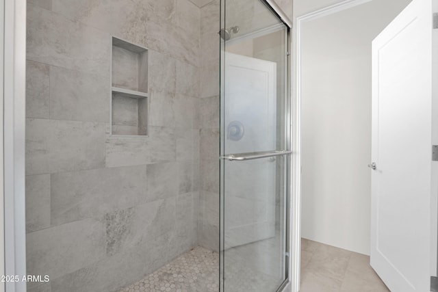 bathroom featuring tile patterned flooring and walk in shower