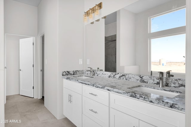 bathroom with tile patterned floors and vanity