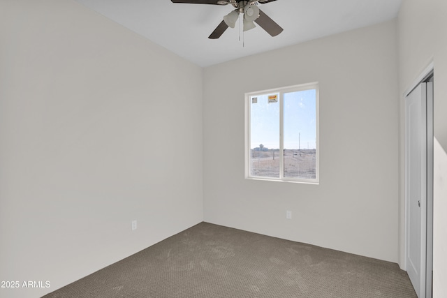 empty room with carpet and ceiling fan