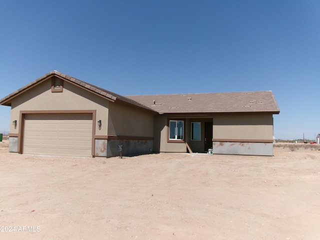 ranch-style home with a garage