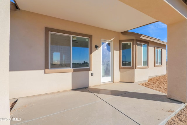 property entrance with a patio area